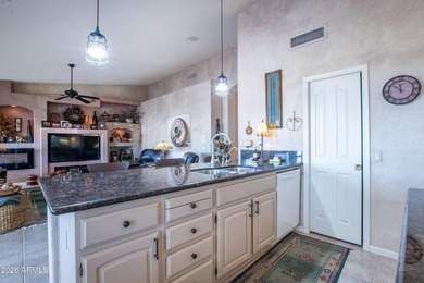 Spacious 3 bed, 2.5 bath home with a 3-car garage sits on a on Eagles Nest at Pebble Creek in Arizona - for sale on GolfHomes.com, golf home, golf lot