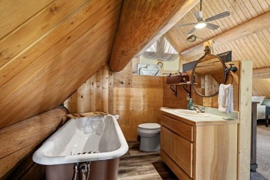Escape the ordinary in this stunning log home sitting on just on Chewelah Golf and Country Club  in Washington - for sale on GolfHomes.com, golf home, golf lot