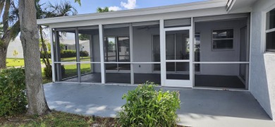Step into this superbly renovated Challenger model on a corner on Leisureville Community Golf Course in Florida - for sale on GolfHomes.com, golf home, golf lot