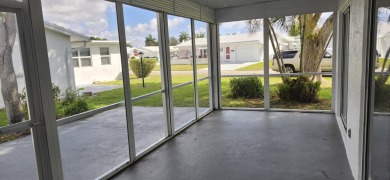 Step into this superbly renovated Challenger model on a corner on Leisureville Community Golf Course in Florida - for sale on GolfHomes.com, golf home, golf lot