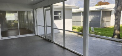 Step into this superbly renovated Challenger model on a corner on Leisureville Community Golf Course in Florida - for sale on GolfHomes.com, golf home, golf lot