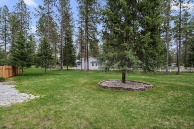 Escape the ordinary in this stunning log home sitting on just on Chewelah Golf and Country Club  in Washington - for sale on GolfHomes.com, golf home, golf lot