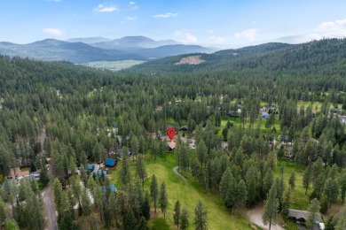 Escape the ordinary in this stunning log home sitting on just on Chewelah Golf and Country Club  in Washington - for sale on GolfHomes.com, golf home, golf lot