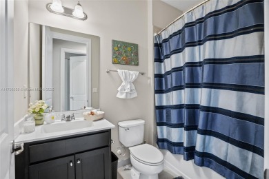 Stunning new lakefront townhouse in a gated golf course on Boca Dunes Golf and Country Club in Florida - for sale on GolfHomes.com, golf home, golf lot