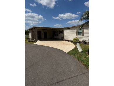 This stunning 2-bedroom, 2-bathroom home, including golf cart on Golden Lakes Golf Course in Florida - for sale on GolfHomes.com, golf home, golf lot
