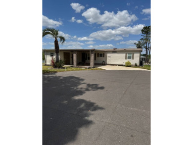 This stunning 2-bedroom, 2-bathroom home, including golf cart on Golden Lakes Golf Course in Florida - for sale on GolfHomes.com, golf home, golf lot