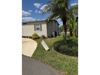 This stunning 2-bedroom, 2-bathroom home, including golf cart on Golden Lakes Golf Course in Florida - for sale on GolfHomes.com, golf home, golf lot