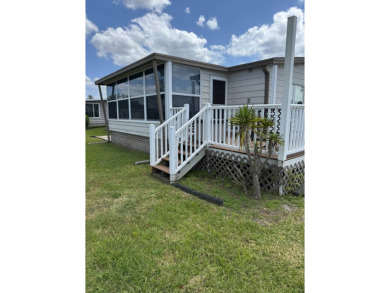 This stunning 2-bedroom, 2-bathroom home, including golf cart on Golden Lakes Golf Course in Florida - for sale on GolfHomes.com, golf home, golf lot