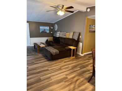This stunning 2-bedroom, 2-bathroom home, including golf cart on Golden Lakes Golf Course in Florida - for sale on GolfHomes.com, golf home, golf lot