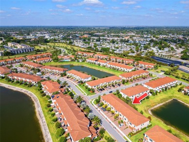 Stunning new lakefront townhouse in a gated golf course on Boca Dunes Golf and Country Club in Florida - for sale on GolfHomes.com, golf home, golf lot
