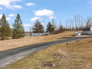 Charming 2-bedroom, 1 full bathroom cottage with subtle lake on Apple Island Golf Course At Apple Island Resort in Vermont - for sale on GolfHomes.com, golf home, golf lot