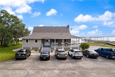 Nestled in the tranquil, picturesque fishing village of Shellman on Sapelo Hammock Golf Club in Georgia - for sale on GolfHomes.com, golf home, golf lot