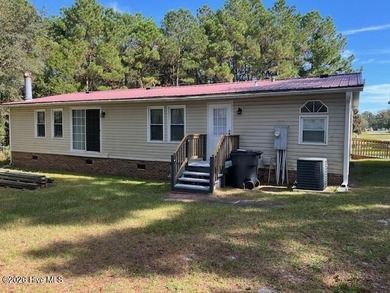 Located at the end of a cul-de-sac, this spacious 3BR/2BA home on Ocean Ridge Plantation in North Carolina - for sale on GolfHomes.com, golf home, golf lot