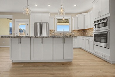 This newly built home in Cedaredge sits just to the north of Tee on Cedaredge Golf Course in Colorado - for sale on GolfHomes.com, golf home, golf lot