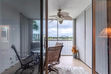 EXPERIENCE EPIC VIEWS from this Gorgeous Updated Lakefront Condo on Palm-Aire Country Club and Resort - Palms in Florida - for sale on GolfHomes.com, golf home, golf lot