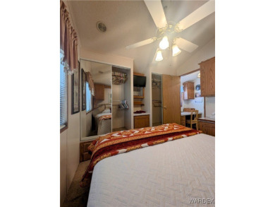 Perfect snowbird retreat. The enclosed patio offers extra room on Riverview Golf Course in Arizona - for sale on GolfHomes.com, golf home, golf lot