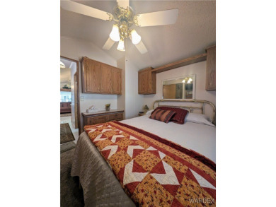 Perfect snowbird retreat. The enclosed patio offers extra room on Riverview Golf Course in Arizona - for sale on GolfHomes.com, golf home, golf lot