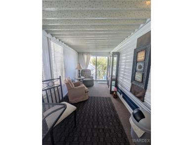 Perfect snowbird retreat. The enclosed patio offers extra room on Riverview Golf Course in Arizona - for sale on GolfHomes.com, golf home, golf lot