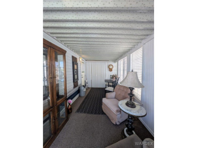 Perfect snowbird retreat. The enclosed patio offers extra room on Riverview Golf Course in Arizona - for sale on GolfHomes.com, golf home, golf lot