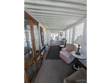 Perfect snowbird retreat. The enclosed patio offers extra room on Riverview Golf Course in Arizona - for sale on GolfHomes.com, golf home, golf lot