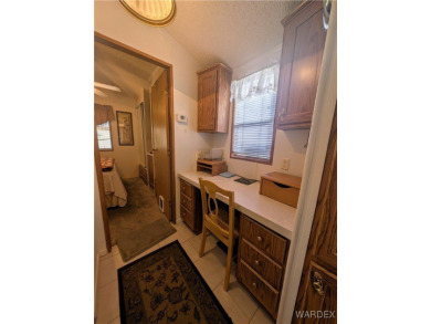 Perfect snowbird retreat. The enclosed patio offers extra room on Riverview Golf Course in Arizona - for sale on GolfHomes.com, golf home, golf lot
