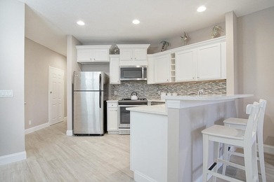 Golf course views, a waterfront lot, and two seperate units all on The Legacy Golf and Tennis Club in Florida - for sale on GolfHomes.com, golf home, golf lot