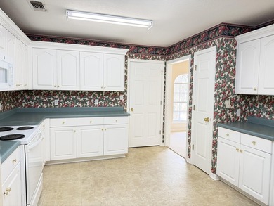 Enjoy the perfect sunset from the massive  picture windows on Pine Creek Golf Club in Mississippi - for sale on GolfHomes.com, golf home, golf lot