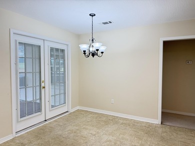 Enjoy the perfect sunset from the massive  picture windows on Pine Creek Golf Club in Mississippi - for sale on GolfHomes.com, golf home, golf lot