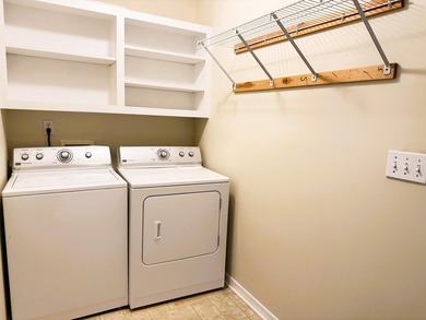 Enjoy the perfect sunset from the massive  picture windows on Pine Creek Golf Club in Mississippi - for sale on GolfHomes.com, golf home, golf lot