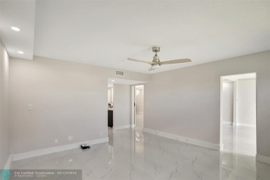 Introducing an exquisite 2-bed 2-bath luxury residence in on Wynmoor Golf Course in Florida - for sale on GolfHomes.com, golf home, golf lot