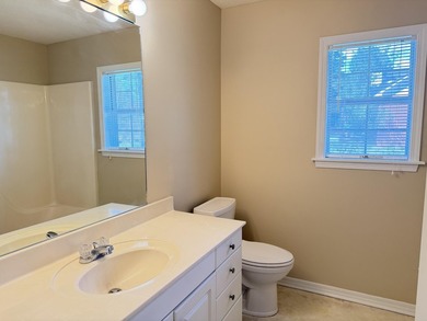 Enjoy the perfect sunset from the massive  picture windows on Pine Creek Golf Club in Mississippi - for sale on GolfHomes.com, golf home, golf lot