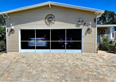 This meticulously cared-for home is as beautiful inside as it is on Big Cypress Golf and Country Club in Florida - for sale on GolfHomes.com, golf home, golf lot