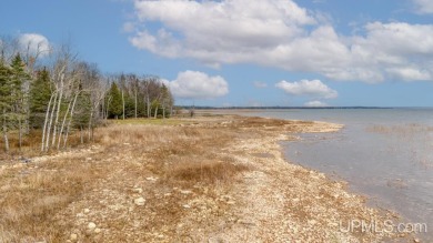 This 1.84-acre lot offers 237 feet of frontage on Lake on Nahma Club in Michigan - for sale on GolfHomes.com, golf home, golf lot