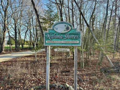 This 1.84-acre lot offers 237 feet of frontage on Lake on Nahma Club in Michigan - for sale on GolfHomes.com, golf home, golf lot