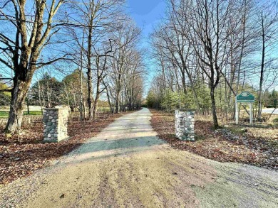 This 1.84-acre lot offers 237 feet of frontage on Lake on Nahma Club in Michigan - for sale on GolfHomes.com, golf home, golf lot