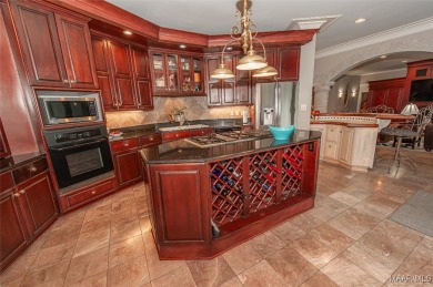 Step into the timeless elegance of this French Provincial on Wynlakes Golf and Country Club in Alabama - for sale on GolfHomes.com, golf home, golf lot