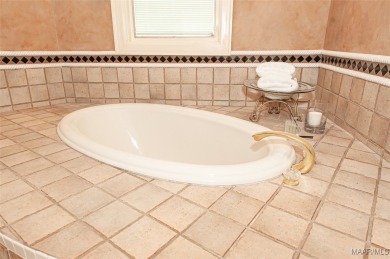 Step into the timeless elegance of this French Provincial on Wynlakes Golf and Country Club in Alabama - for sale on GolfHomes.com, golf home, golf lot