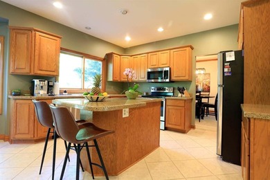 Located on the 14th fairway, this sprawling 4 bdrm home in on Stonebridge Golf Club in Michigan - for sale on GolfHomes.com, golf home, golf lot