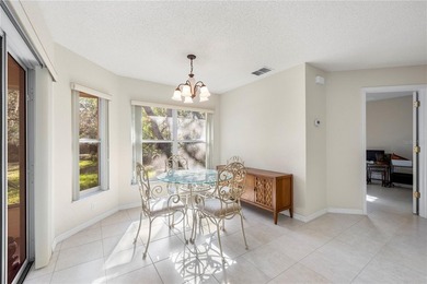 Welcome to this charming and well-maintained 2-bedroom, 2-bath on Oak Hills Country Club in Florida - for sale on GolfHomes.com, golf home, golf lot