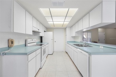 Welcome to this charming and well-maintained 2-bedroom, 2-bath on Oak Hills Country Club in Florida - for sale on GolfHomes.com, golf home, golf lot