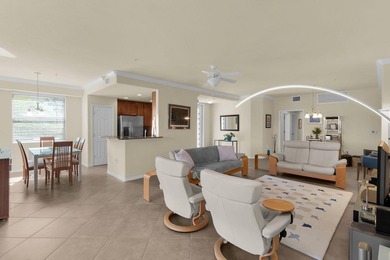 Enjoy a first-floor end-unit coach home with beautiful lake on The Rookery At Marco in Florida - for sale on GolfHomes.com, golf home, golf lot