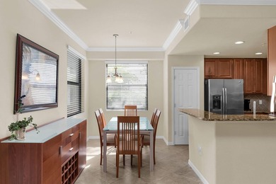 Enjoy a first-floor end-unit coach home with beautiful lake on The Rookery At Marco in Florida - for sale on GolfHomes.com, golf home, golf lot