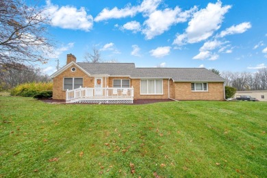 FIVE BEDROOM, expansive first floor home on ALMOST 5.0 acres in on Hickory Hills Golf Club in Michigan - for sale on GolfHomes.com, golf home, golf lot