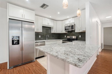 Fully remodeled and move-in ready -- bring on the offers! This on Highland Lakes Executive Golf Course in Florida - for sale on GolfHomes.com, golf home, golf lot