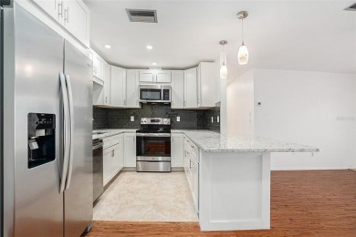 Fully remodeled and move-in ready -- bring on the offers! This on Highland Lakes Executive Golf Course in Florida - for sale on GolfHomes.com, golf home, golf lot