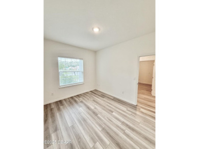 Experience refined, single-story living in this spacious 2,338 on The Grand Club Cypress Course in Florida - for sale on GolfHomes.com, golf home, golf lot