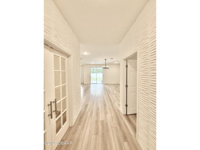 Experience refined, single-story living in this spacious 2,338 on The Grand Club Cypress Course in Florida - for sale on GolfHomes.com, golf home, golf lot