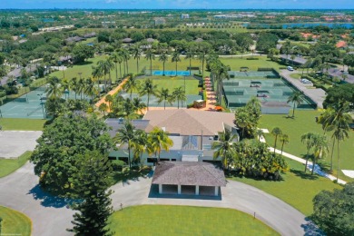 Spectacular lake and preserve views from one of the largest lots on Palm Beach Polo and Country Club in Florida - for sale on GolfHomes.com, golf home, golf lot