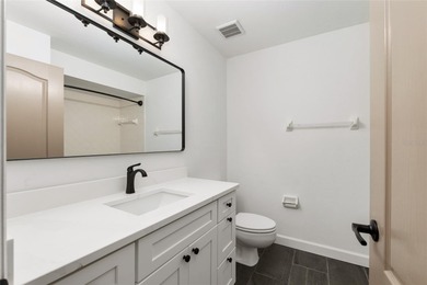 Enjoy easy, maintenance-free living in this beautifully restored on Turkey Creek Golf and Country Club in Florida - for sale on GolfHomes.com, golf home, golf lot