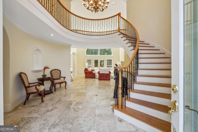 Experience three fully finished levels of exceptional living on The Golf Club of Georgia in Georgia - for sale on GolfHomes.com, golf home, golf lot